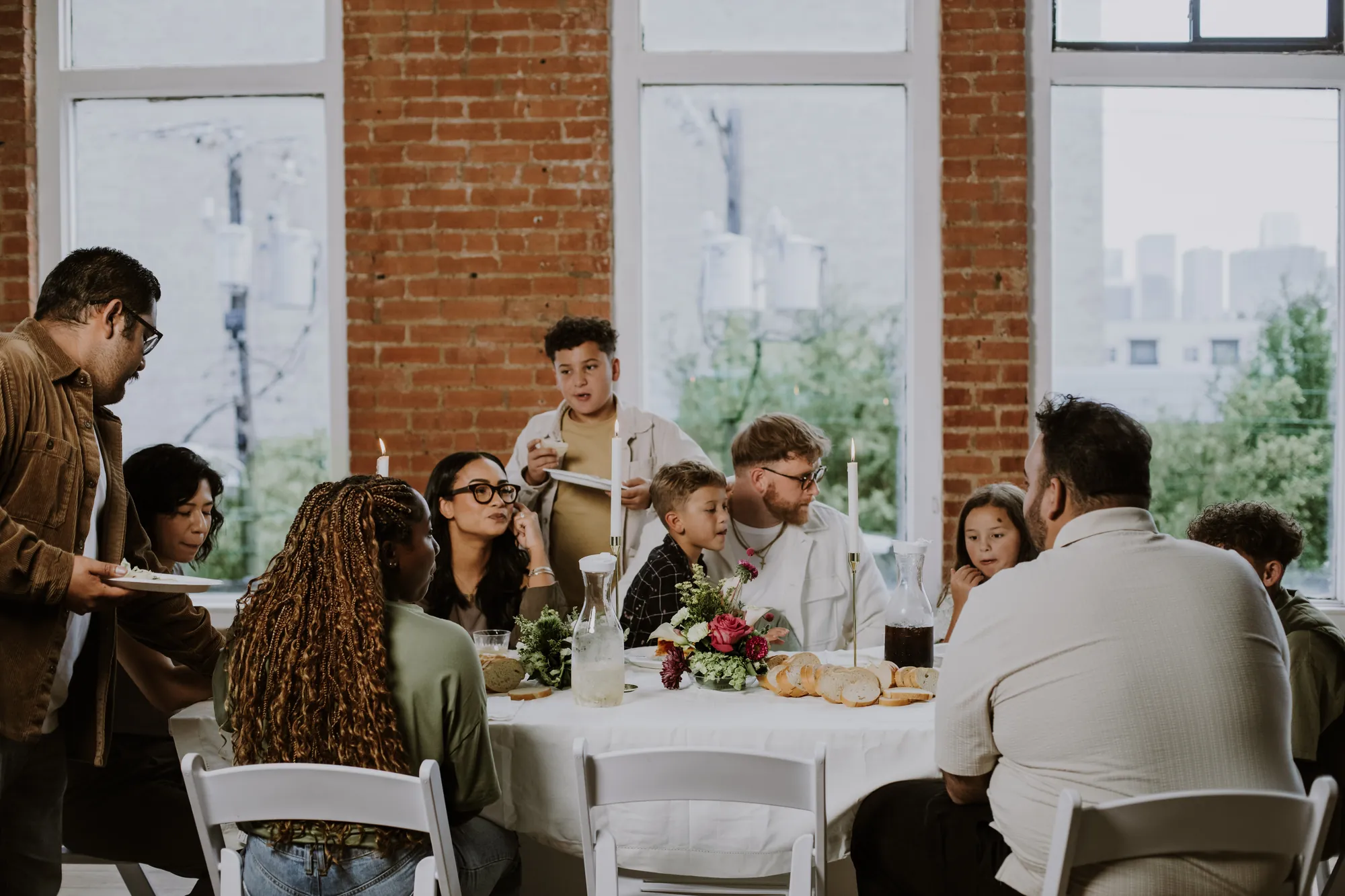 Friends sharing a meal at a long table