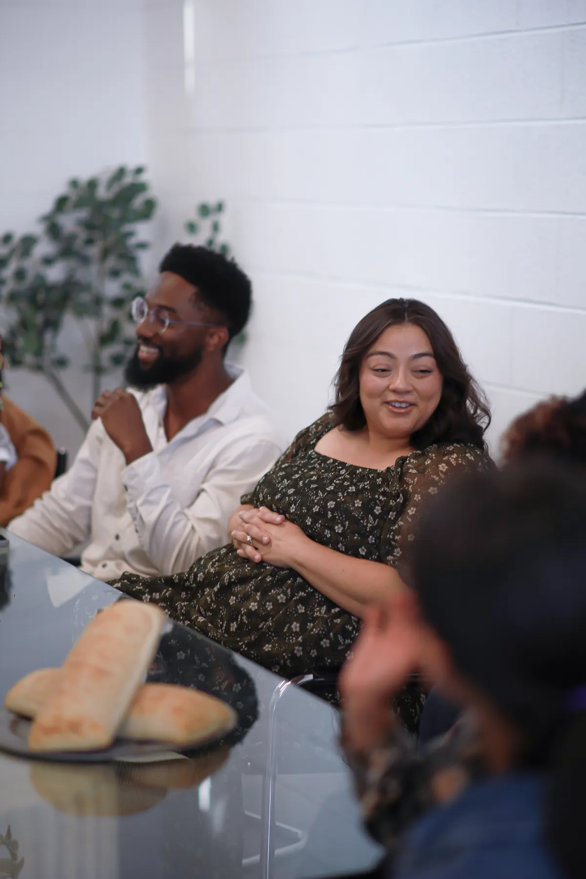 Friends sharing bread at the table