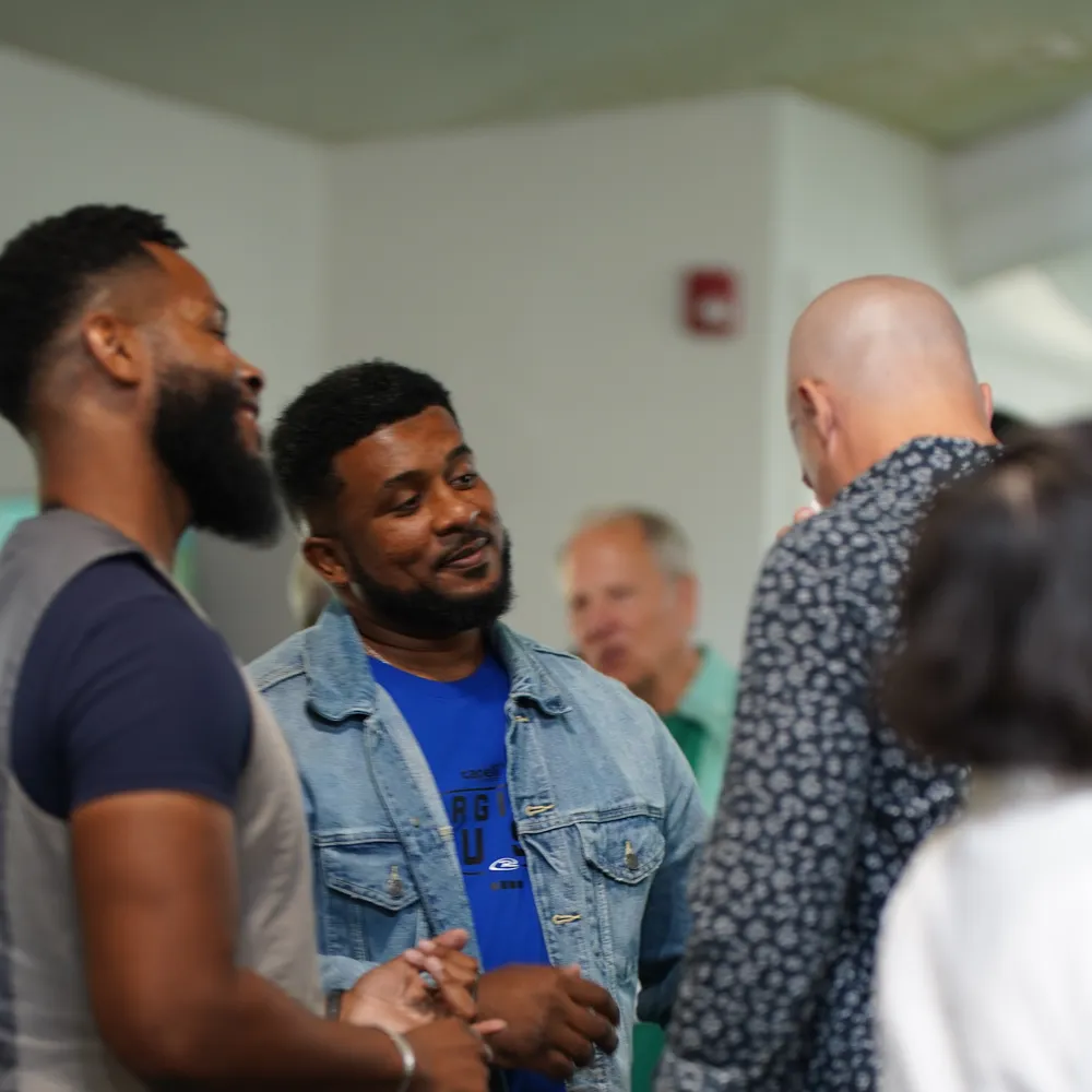 Friends talking together after the Sunday gathering